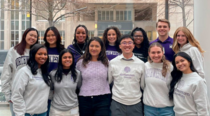 a group of student ambassadors in purple NU sweaters